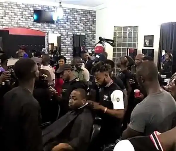 Fans Mob Davido At A Barbing Salon (Photos, Video)